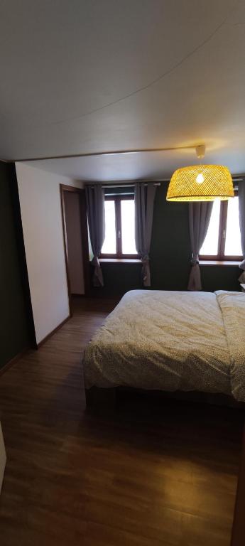 Postel nebo postele na pokoji v ubytování Les gîtes d'Argentin