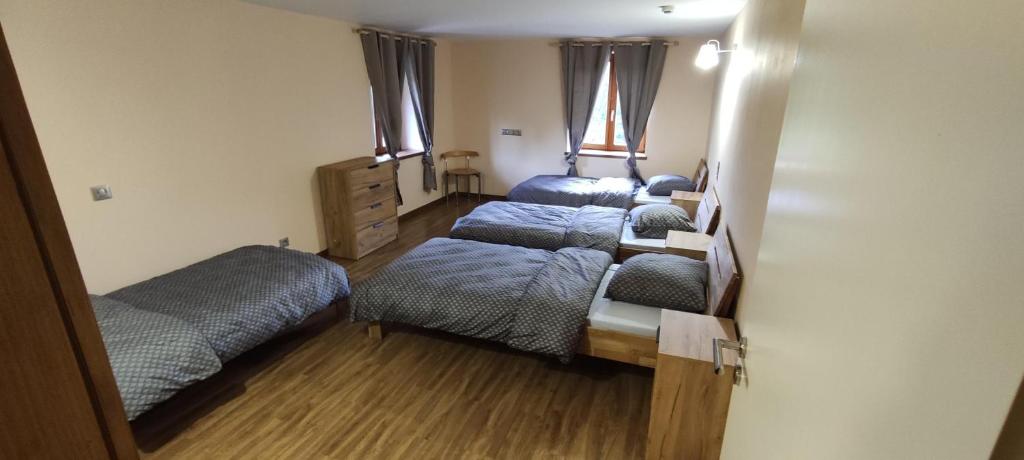 Postel nebo postele na pokoji v ubytování Les gîtes d'Argentin