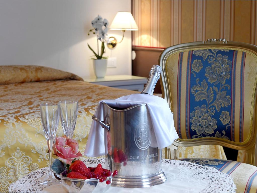 Postel nebo postele na pokoji v ubytování Hotel Corte dei Greci