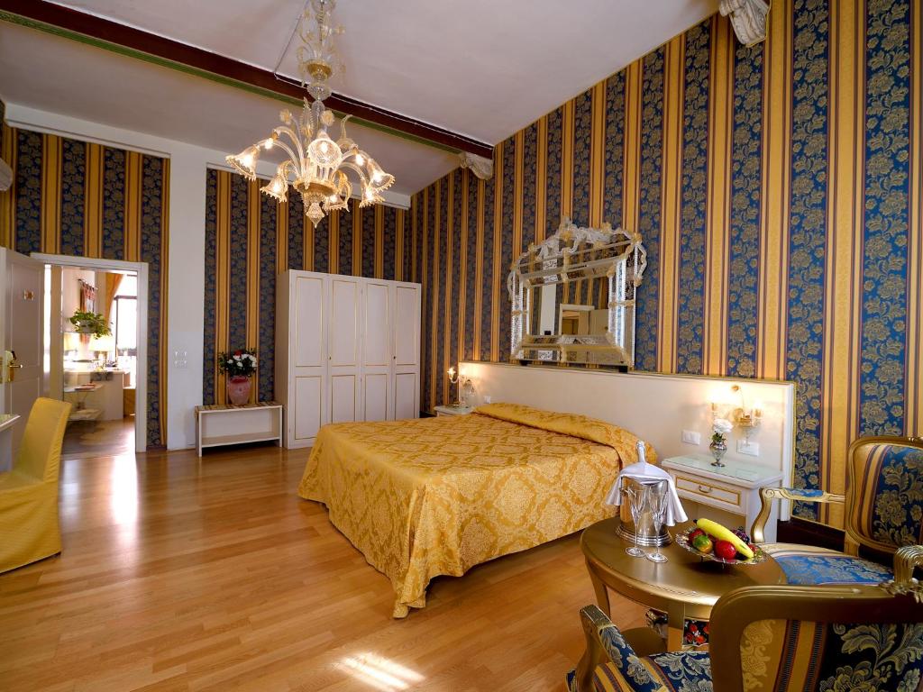 Postel nebo postele na pokoji v ubytování Hotel Corte dei Greci