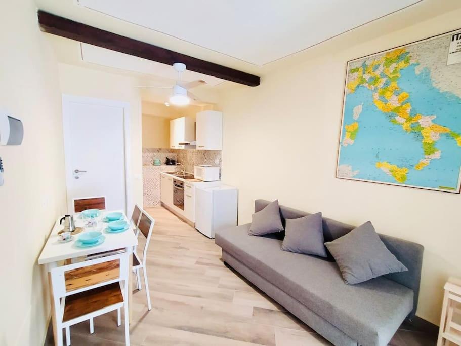 a living room with a couch and a table at Casa Bella The First in Riomaggiore