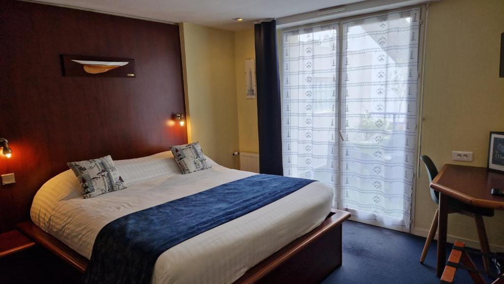 Postel nebo postele na pokoji v ubytování Hotel Le Marin