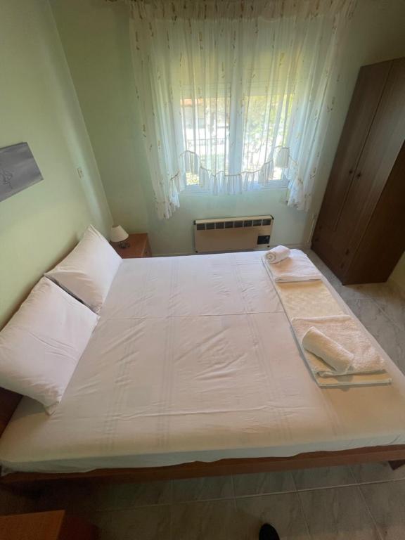 Postel nebo postele na pokoji v ubytování Hοme4U