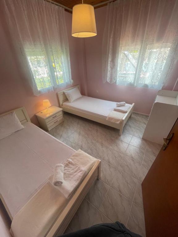 Postel nebo postele na pokoji v ubytování Hοme4U