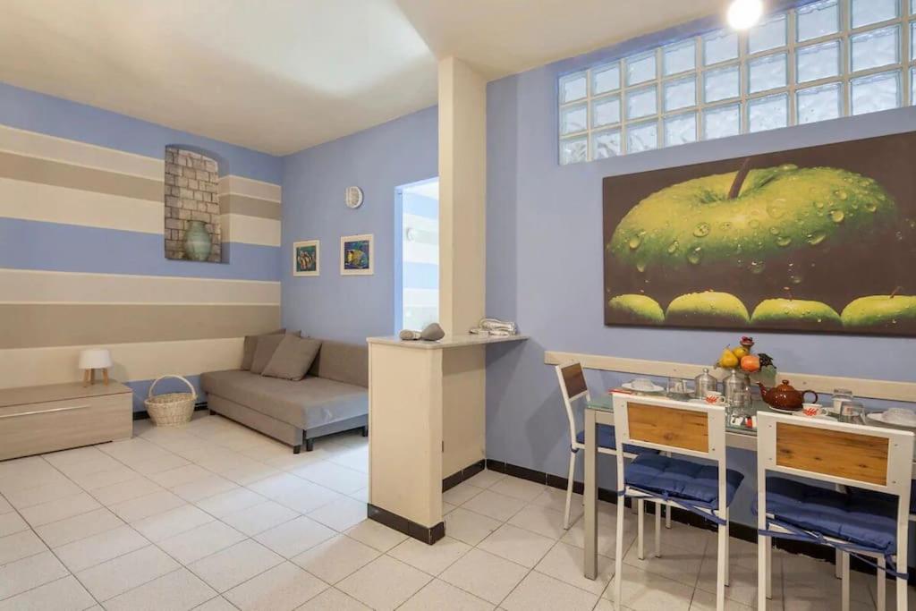 a living room with a couch and a table with chairs at Casa Nonna in Riomaggiore