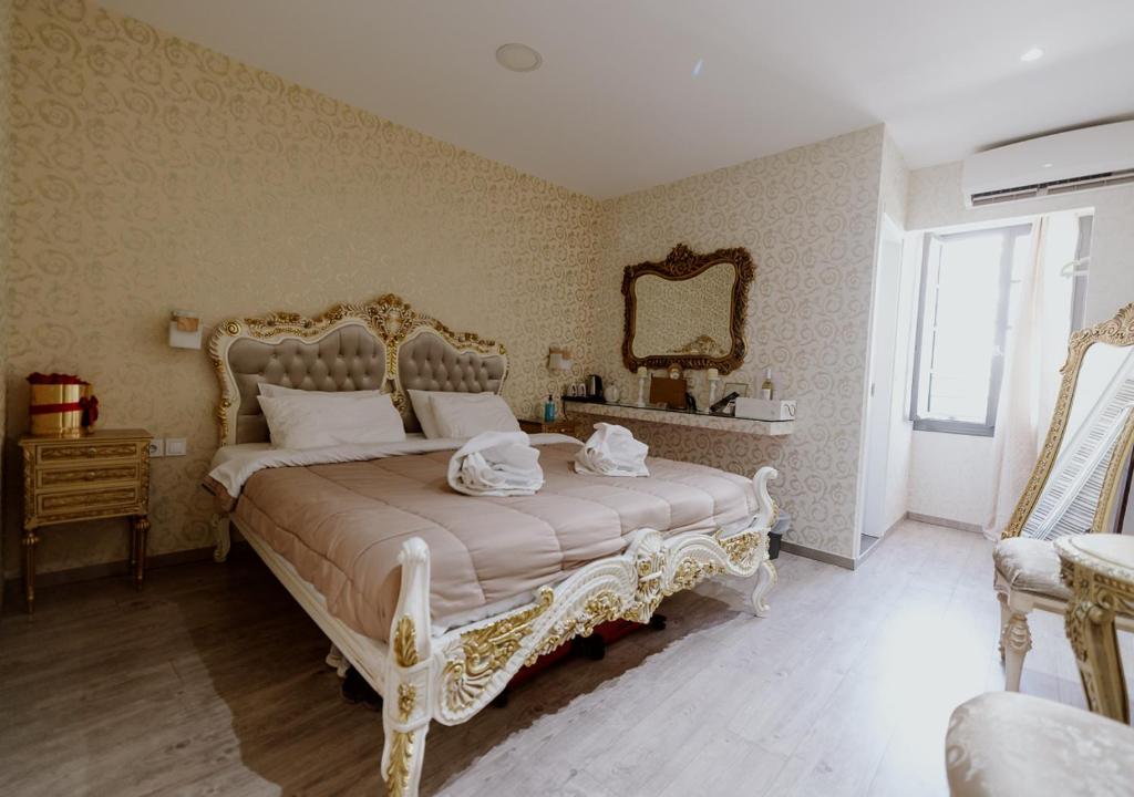 Posteľ alebo postele v izbe v ubytovaní ROH Suites