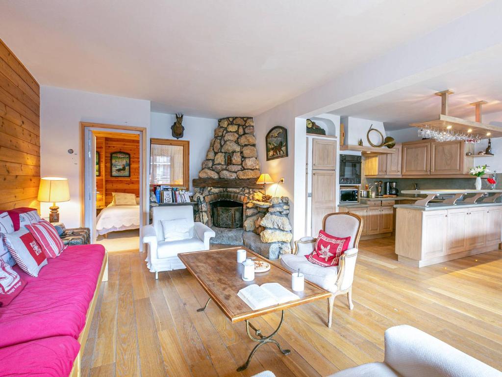 a living room with a couch and a fireplace at Appartement Val-d'Isère, 4 pièces, 6 personnes - FR-1-694-130 in Val-d'Isère