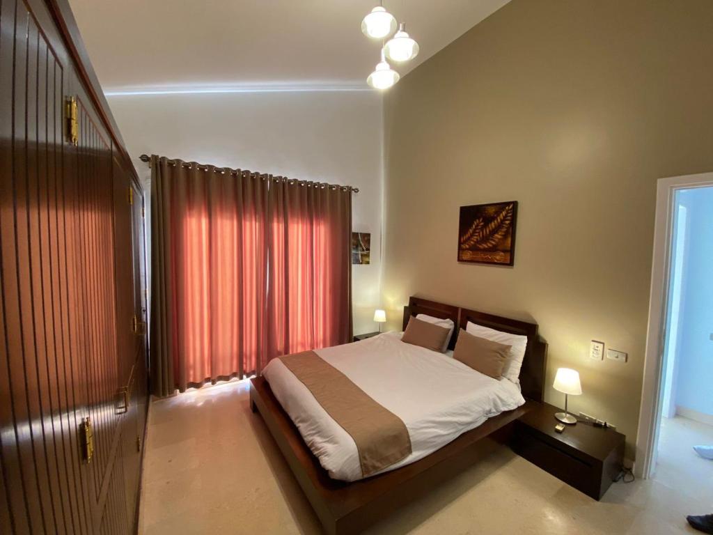 Postel nebo postele na pokoji v ubytování Babel Apartments el gouna