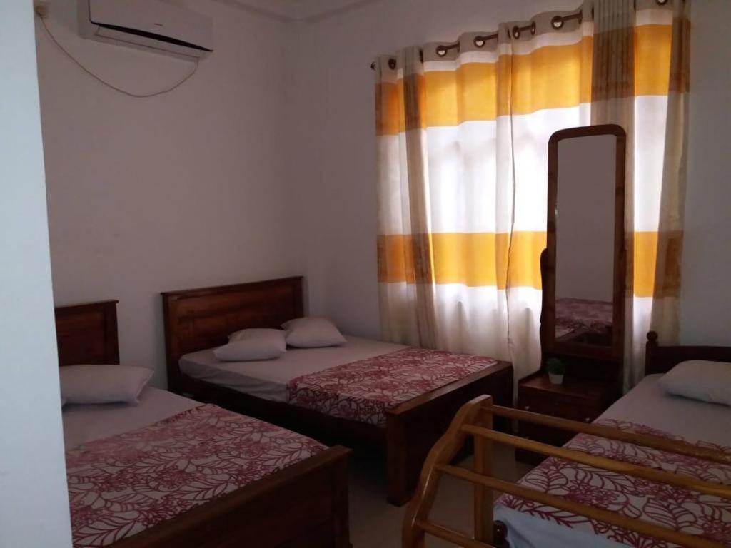 Postel nebo postele na pokoji v ubytování Kumudu Holiday Home