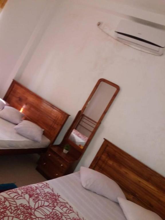 Postel nebo postele na pokoji v ubytování Kumudu Holiday Home