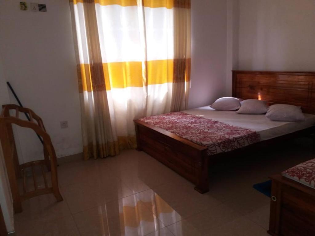 Postel nebo postele na pokoji v ubytování Kumudu Holiday Home