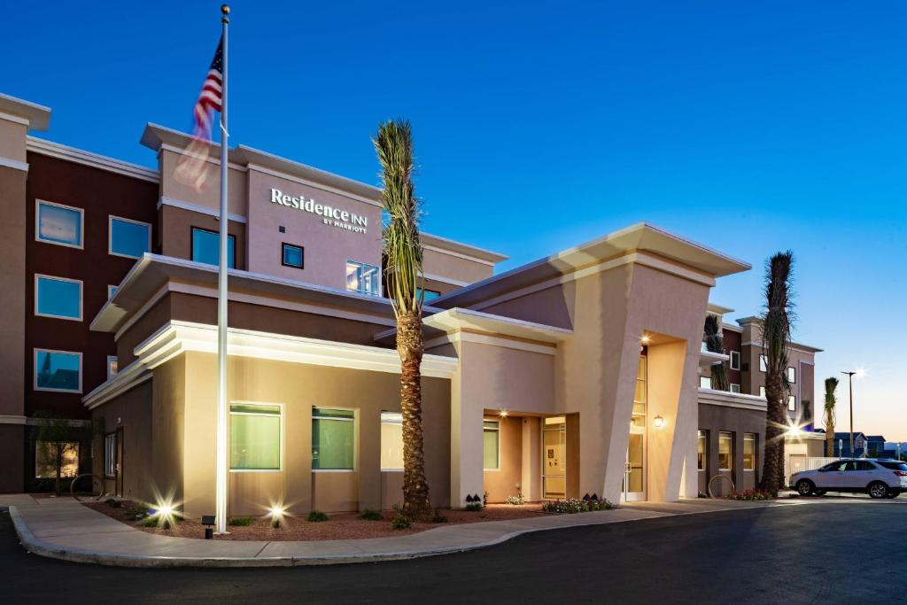 a hotel with a palm tree in front of a building at Residence Inn Las Vegas South/Henderson in Las Vegas