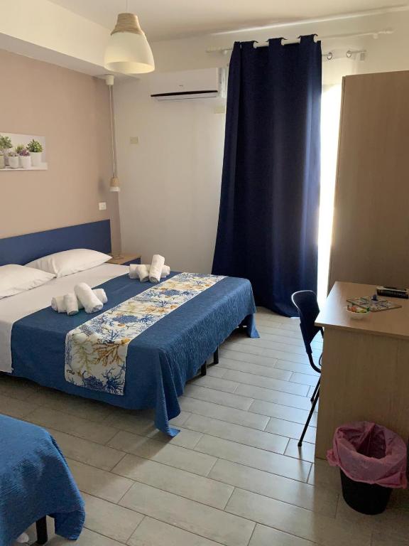 Postel nebo postele na pokoji v ubytování Giostemar Rooms - Playa Grande