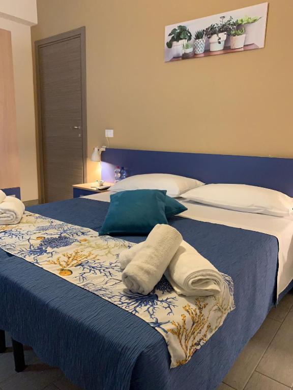 Postel nebo postele na pokoji v ubytování Giostemar Rooms - Playa Grande
