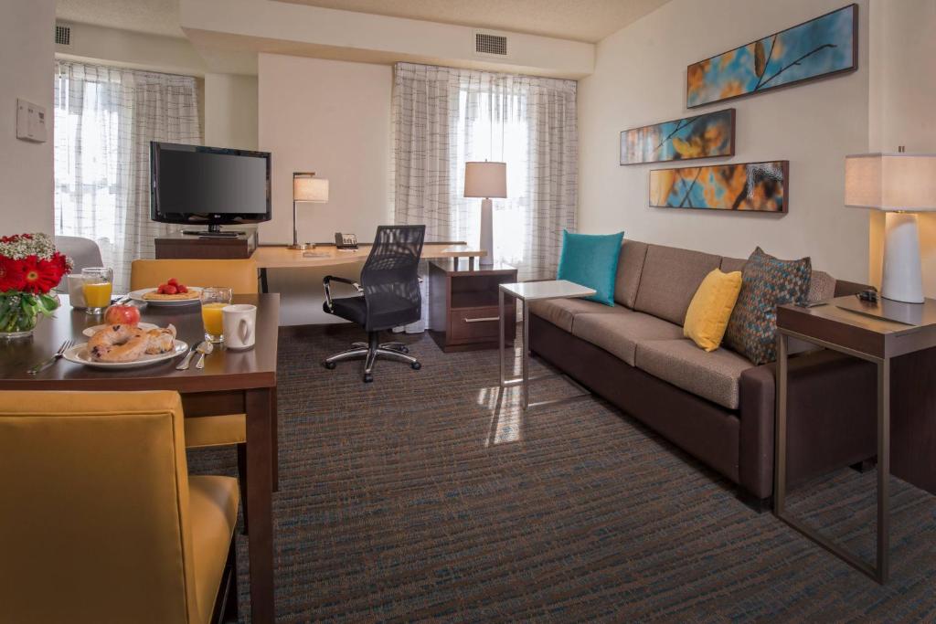 a living room with a couch and a table at Residence Inn Arlington Rosslyn in Arlington