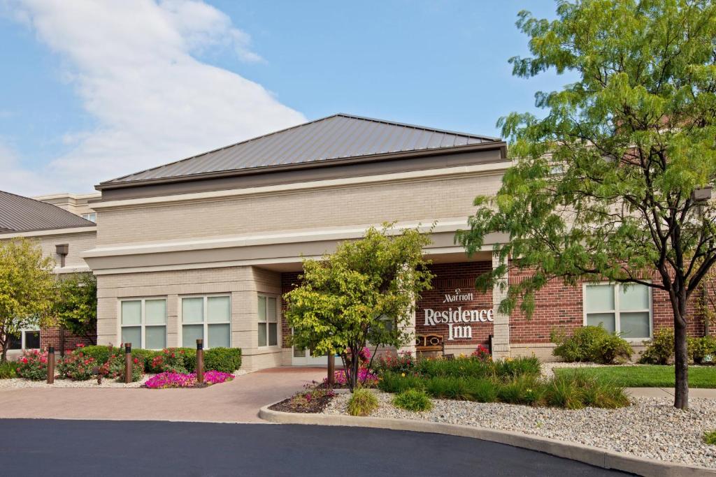 a building with a sign on the front of it at Residence Inn Indianapolis Carmel in Carmel