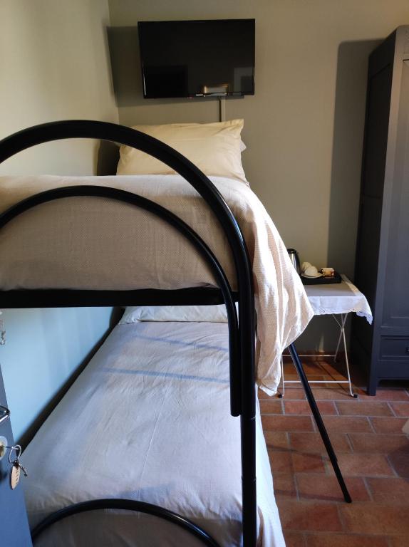Łóżko lub łóżka w pokoju w obiekcie B & B Casolara