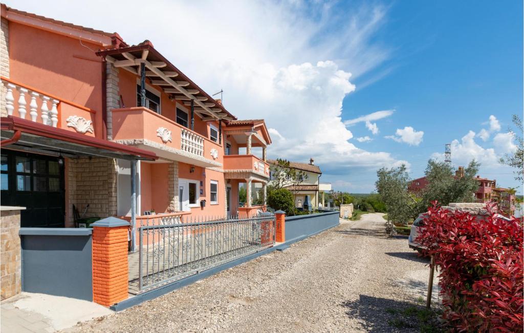 a street in a village with houses at Apartment Betiga With Sea View 02 in Barbariga