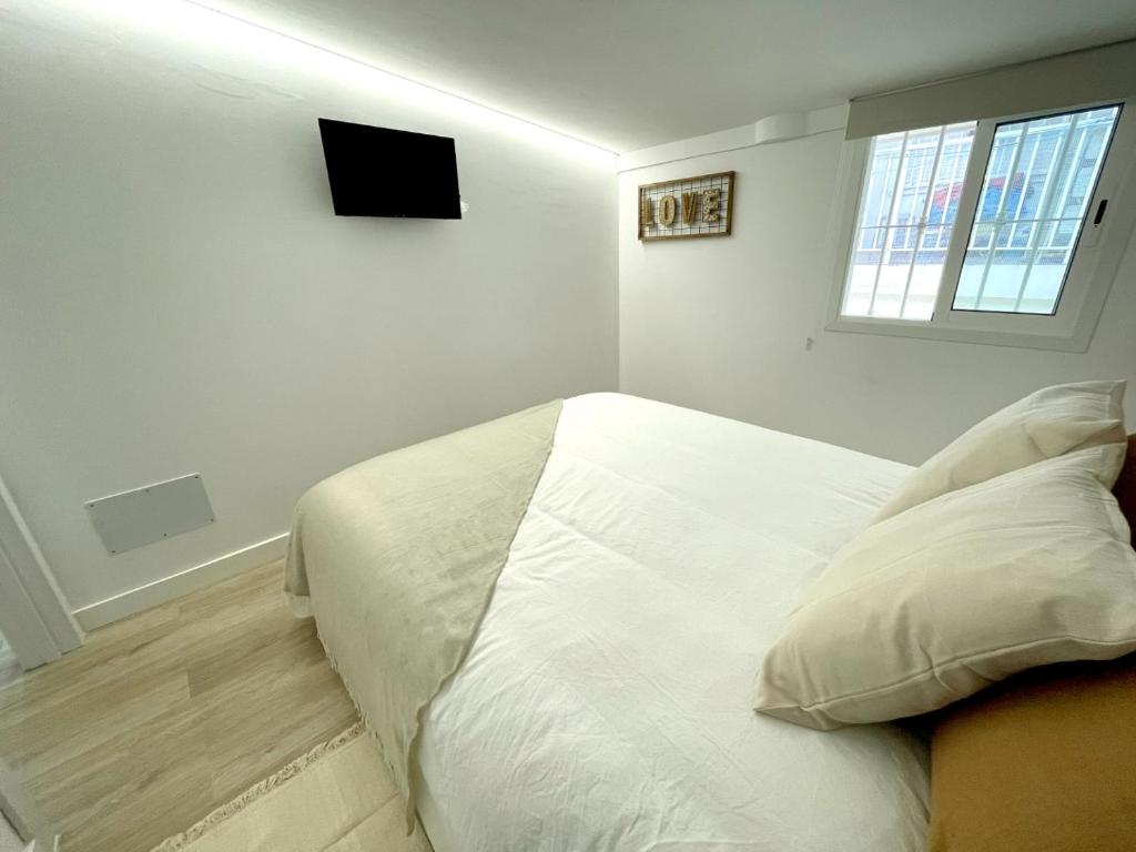 TV a/nebo společenská místnost v ubytování A&C Casa playa Torre del mar-Málaga