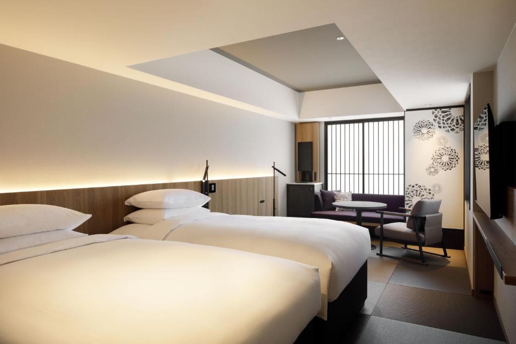 Postel nebo postele na pokoji v ubytování The Chapter Kyoto, a Tribute Portfolio Hotel