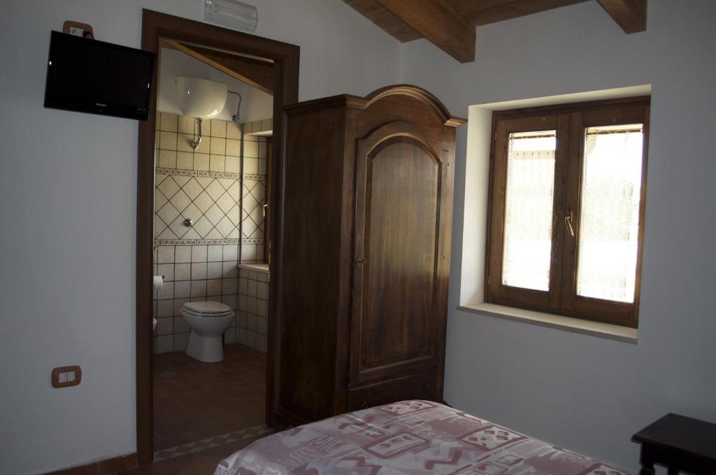 Posteľ alebo postele v izbe v ubytovaní Agriturismo La Colombaia