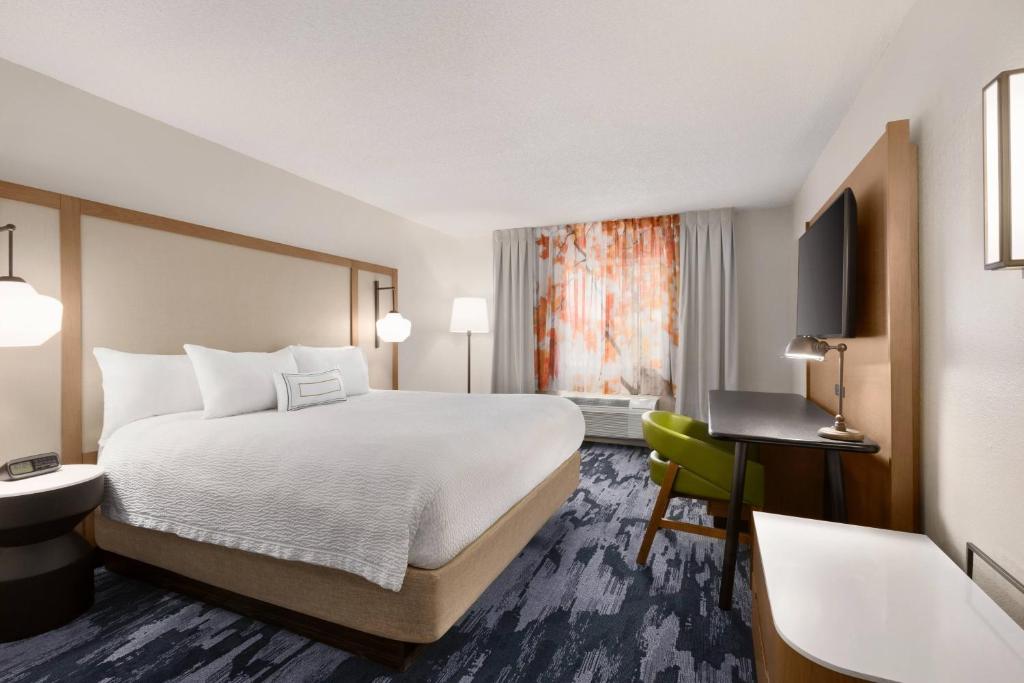 a hotel room with a bed and a television at Fairfield Inn by Marriott Erie Millcreek Mall in Erie