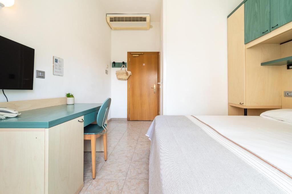 Postel nebo postele na pokoji v ubytování Hotel Ettoral
