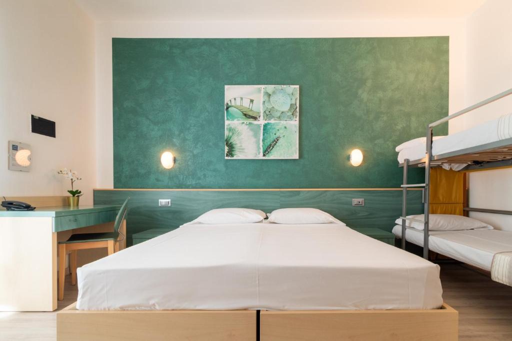 Postel nebo postele na pokoji v ubytování Hotel Ettoral