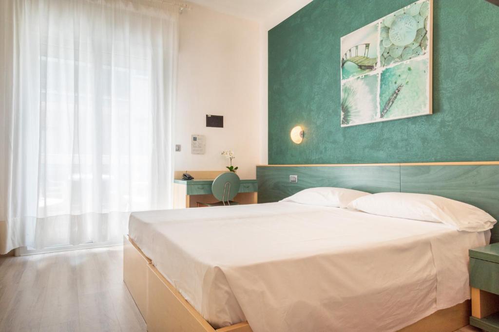 Postel nebo postele na pokoji v ubytování Hotel Ettoral