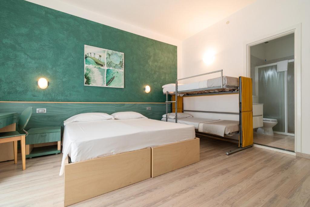 Postel nebo postele na pokoji v ubytování Hotel Ettoral