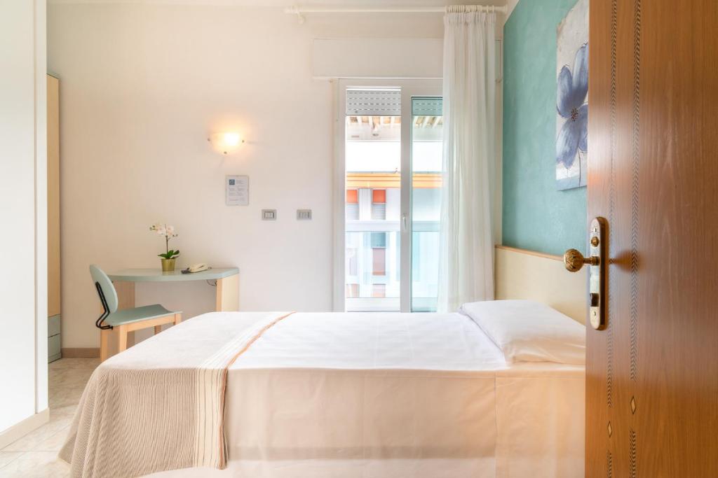 Postel nebo postele na pokoji v ubytování Hotel Ettoral