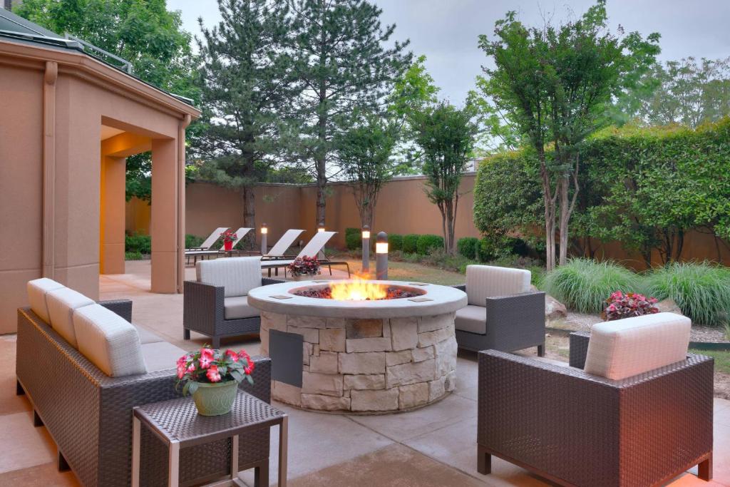 a patio with a fire pit in a yard at Courtyard by Marriott Oklahoma City Northwest in Oklahoma City