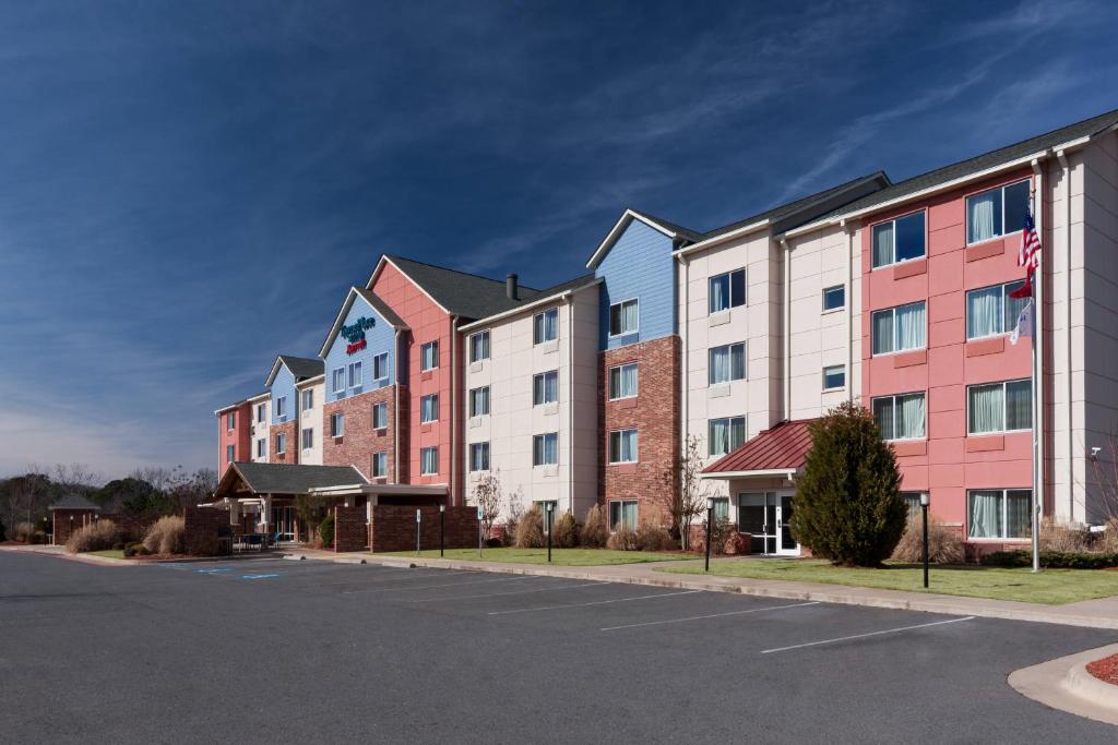 a row of buildings in a parking lot at TownePlace Suites by Marriott Little Rock West in Little Rock