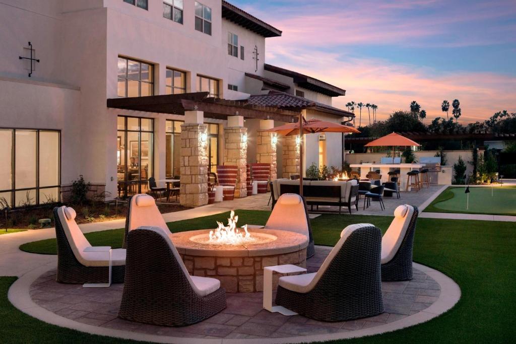 a patio with a fire pit in the backyard of a house at Residence Inn by Marriott Santa Barbara Goleta in Santa Barbara