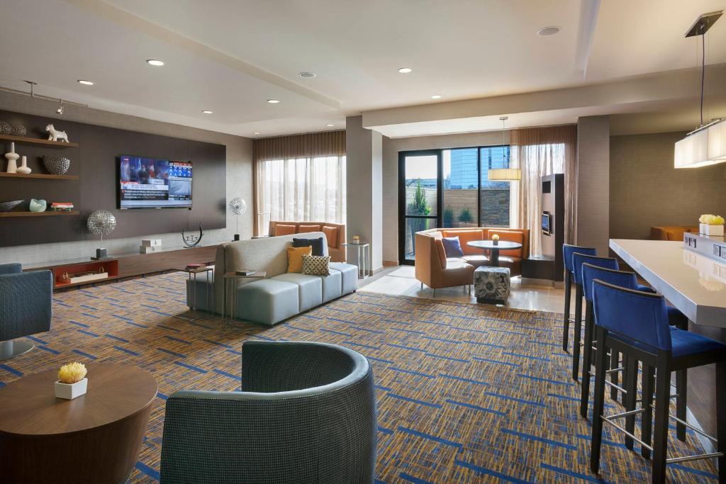 a lobby with a living room and a waiting room at Courtyard by Marriott Toronto Northeast/Markham in Markham