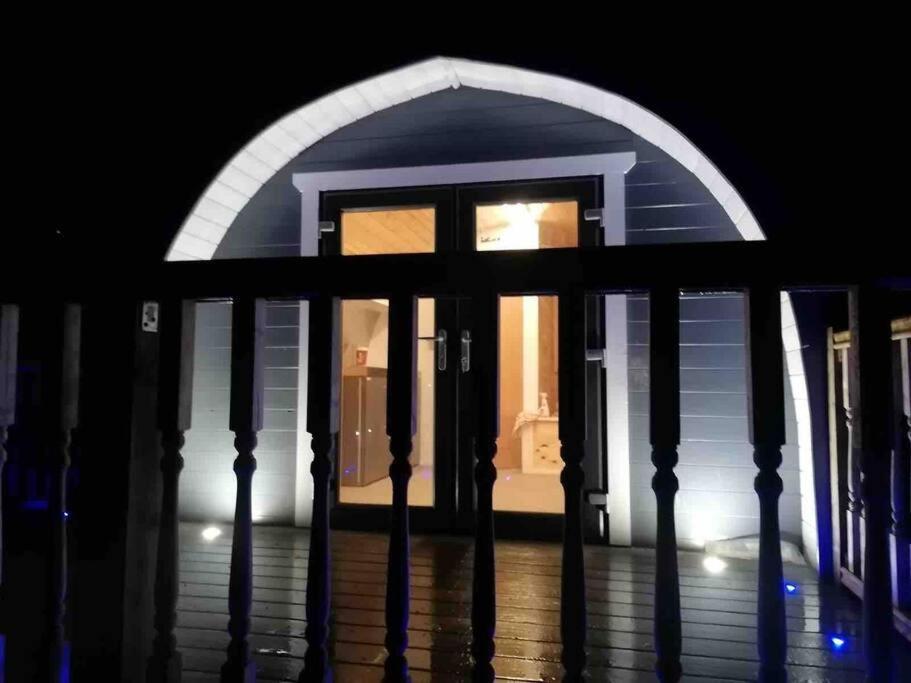 a front door of a house at night at Bonnie Brae Pod in Fort William