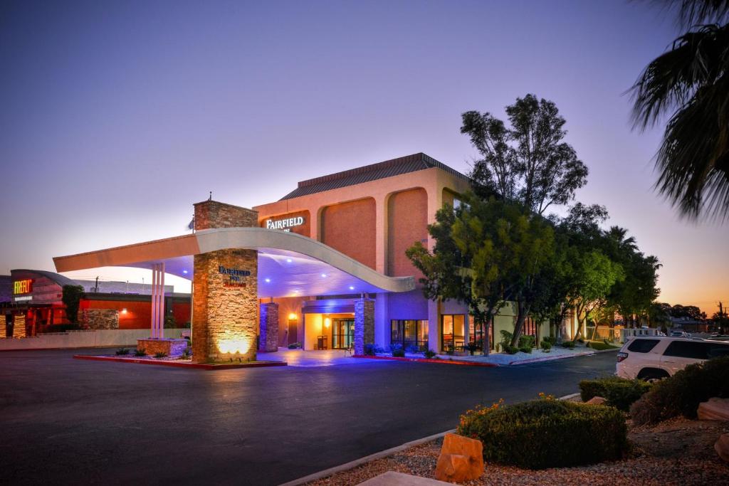 a building with a car parked in a parking lot at Fairfield Inn Las Vegas Convention Center in Las Vegas