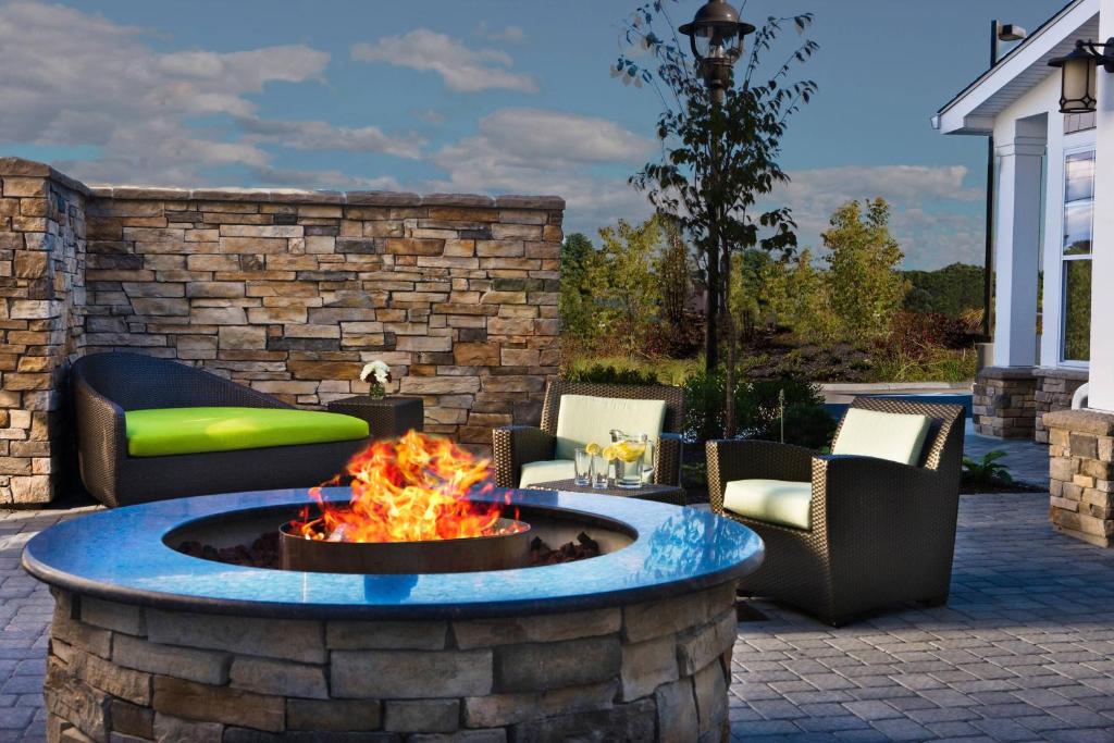 a fire pit in the middle of a patio at Residence Inn by Marriott Auburn in Auburn