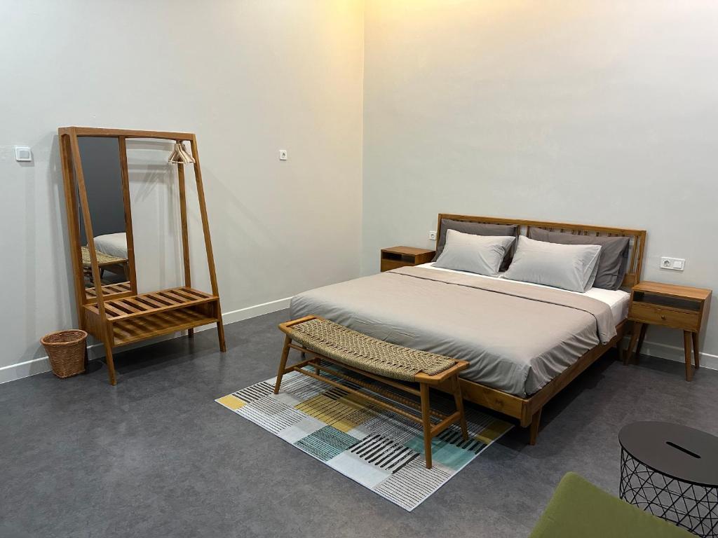 Postel nebo postele na pokoji v ubytování Cendhani Raras Gallery