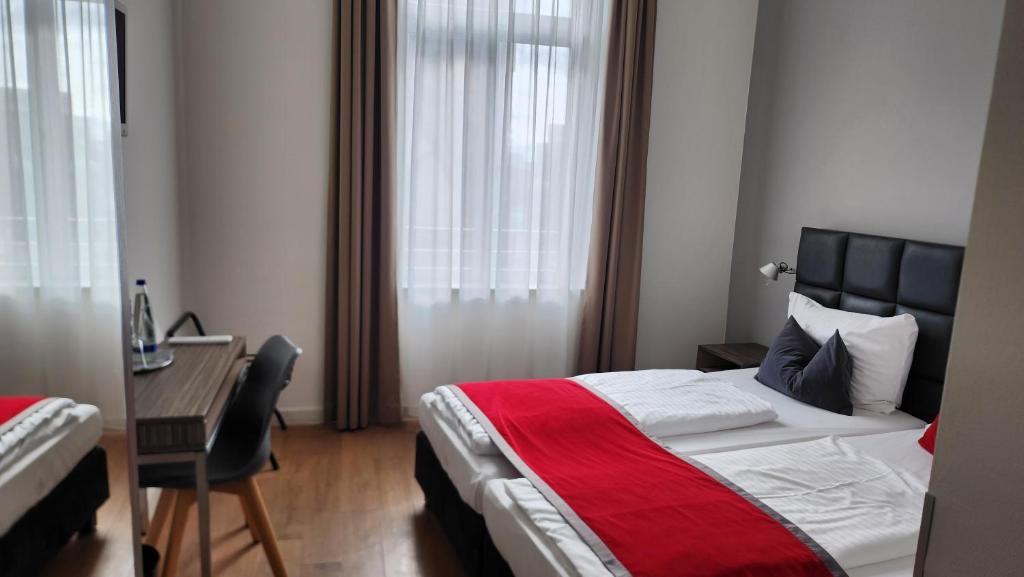 Postel nebo postele na pokoji v ubytování Gideon Hotel