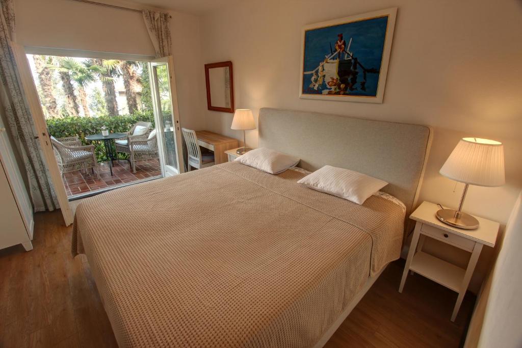 Łóżko lub łóżka w pokoju w obiekcie Premium Apartments Punta Kolova