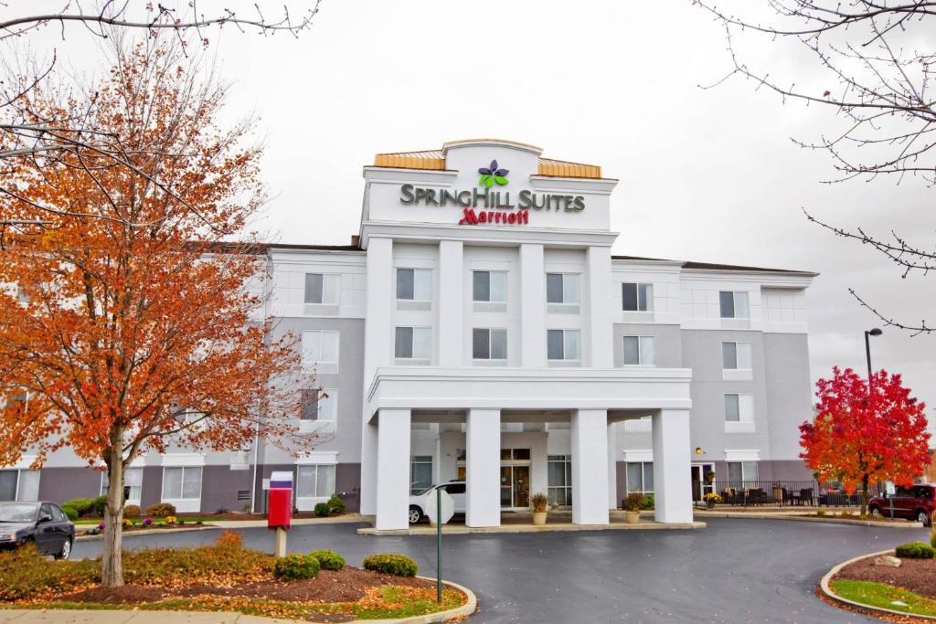 a large white building with a sign on it at SpringHill Suites Pittsburgh Monroeville in Monroeville