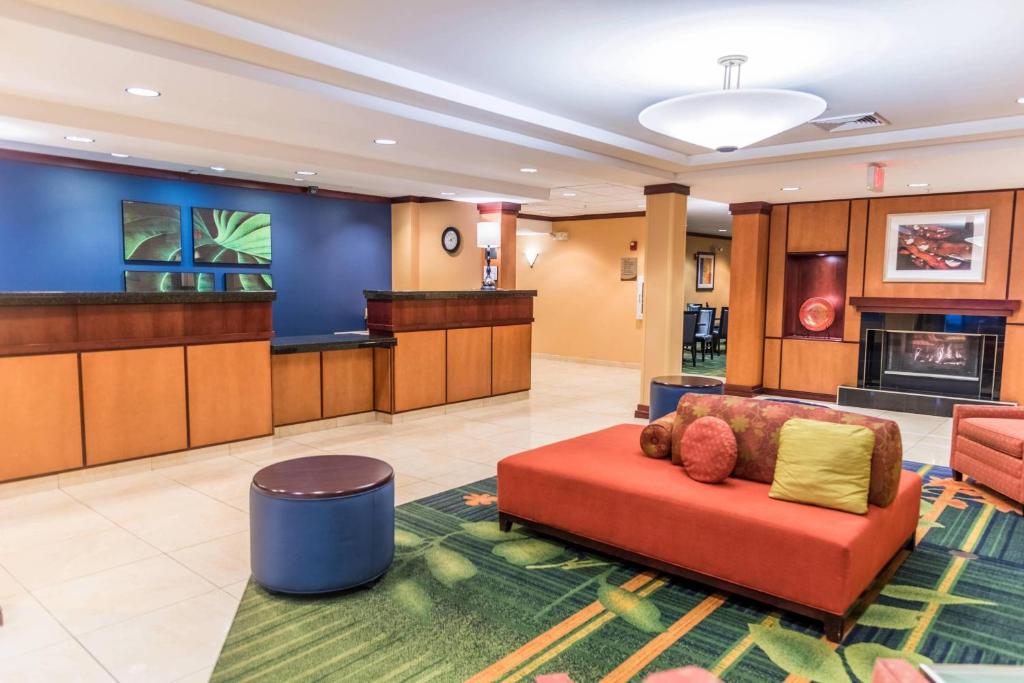 a lobby with a couch and a fireplace at Fairfield Inn & Suites by Marriott Muskegon Norton Shores in Norton Shores