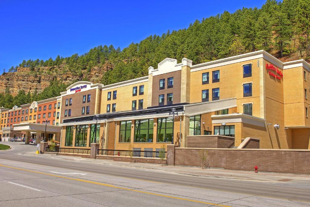 a building on the side of a street at SpringHill Suites by Marriott Deadwood in Deadwood