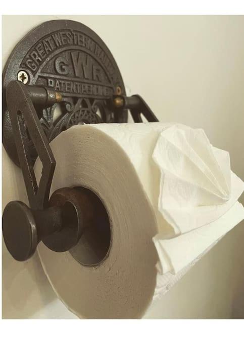 a roll of toilet paper sitting on top of a holder at The Railway Cottage Bridgnorth in Bridgnorth