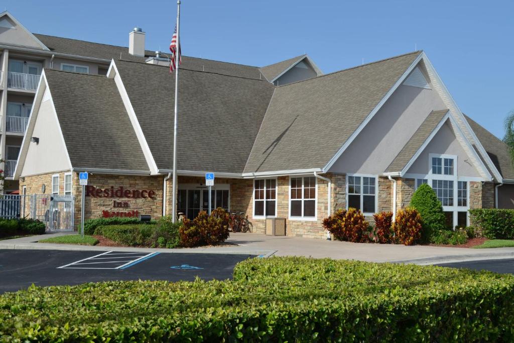 a hotel with an american flag in front of a building at Residence Inn by Marriott Sebring in Sebring