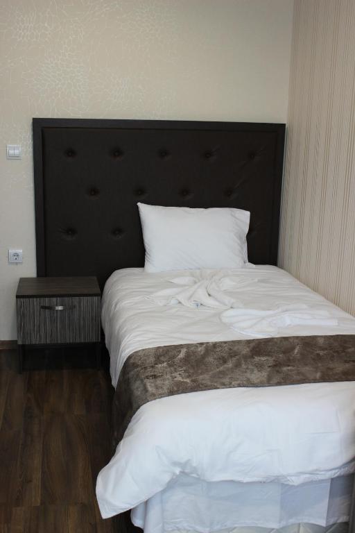 Postel nebo postele na pokoji v ubytování Family Hotel Silistra