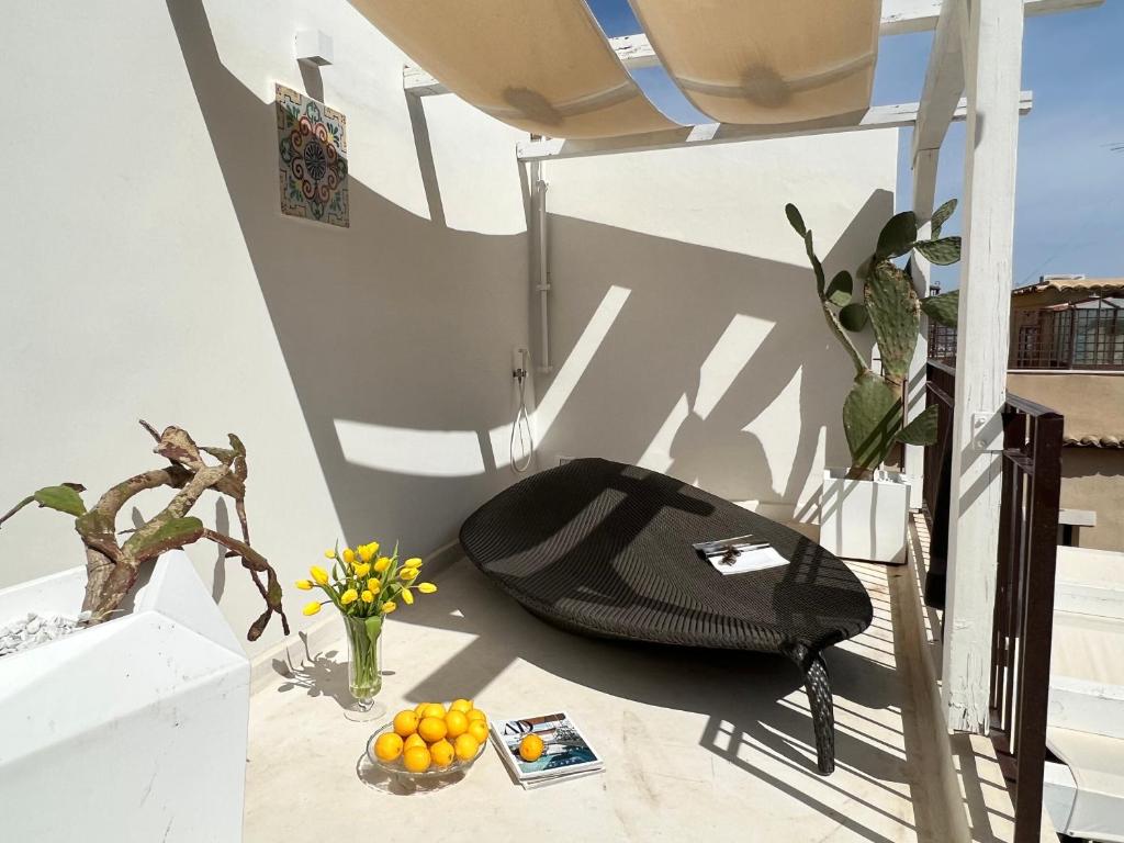 a black bag sitting on the floor in a room at Terme Luxury Suite in Taormina