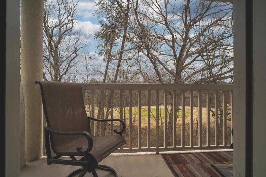 a rocking chair sitting on a porch looking out a window at Gv - Unit 1502 - Happy Time Bear in Pigeon Forge