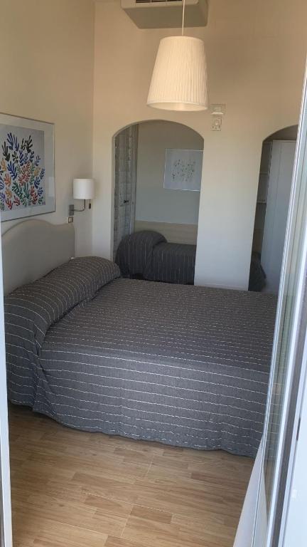 Postel nebo postele na pokoji v ubytování Hotel Rosati